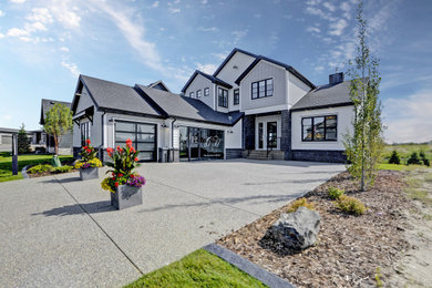 Mid-sized farmhouse gray two-story mixed siding and board and batten exterior home photo in Calgary with a shingle roof and a black roof