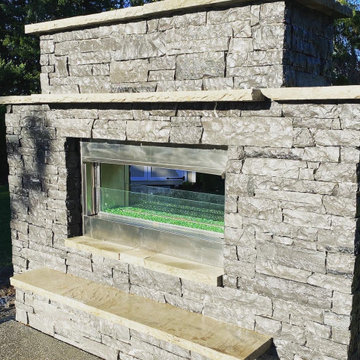 Outdoor kitchen and pass through gas fireplace