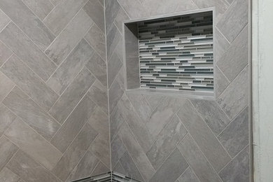 Mid-sized trendy master matchstick tile, black tile, black and white tile and gray tile tub/shower combo photo in Baltimore with gray walls