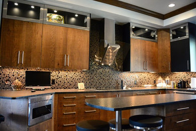 Large modern u-shaped separate kitchen in Oklahoma City with an undermount sink, flat-panel cabinets, medium wood cabinets, granite benchtops, black splashback, glass tile splashback, stainless steel appliances, ceramic floors and with island.