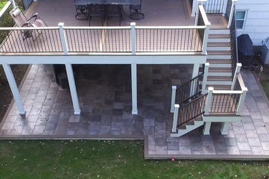 Mid-sized backyard deck photo in Other