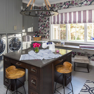 Inspiration for a traditional l-shaped utility room in Minneapolis with shaker cabinets, grey cabinets, granite worktops, multi-coloured walls, a side by side washer and dryer and grey floors.