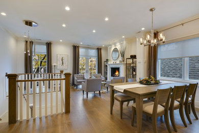 Transitional medium tone wood floor and brown floor great room photo in Chicago with white walls