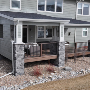 Castle Rock Covered Deck with Fireplace and Iron Railing