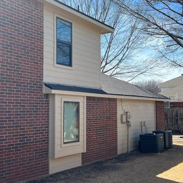 Primed James Hardie Siding in Universal Khaki.