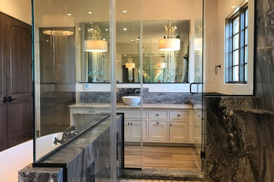 Inspiration for an expansive transitional master bathroom in San Francisco with shaker cabinets, white cabinets, a freestanding tub, an open shower, porcelain floors, a vessel sink, marble benchtops and beige floor.