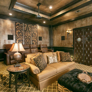 Mediterranean enclosed home cinema in New Orleans with carpet, a projector screen and multi-coloured floors.
