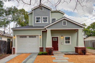 Small arts and crafts two-storey green exterior in Sacramento with mixed siding.