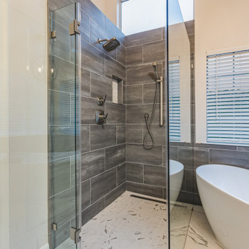 Sleek bathroom remodel in Centerville, VA with double vanity & walk-in shower