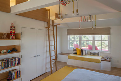 Inspiration for a large contemporary boy light wood floor and beige floor kids' room remodel in New York with white walls