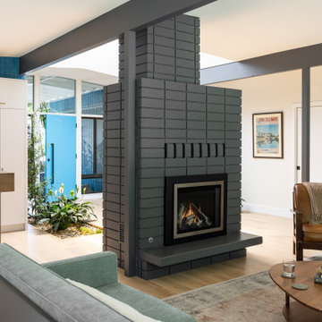 Mid-Century Modern Living Room with Grey Brick Fireplace and Living Atrium