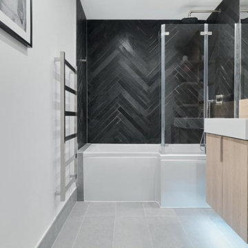 Monochrome Small Bathroom Design with Black Herringbone Tiles