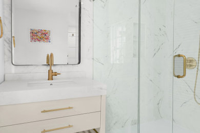 Example of a large minimalist master white tile and marble tile single-sink, marble floor and white floor corner shower design in New York with open cabinets, beige cabinets, an integrated sink, marble countertops, a hinged shower door, white countertops, a freestanding vanity, a two-piece toilet, white walls and a niche