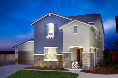 Inspiration for a large timeless gray stone exterior home remodel in Sacramento