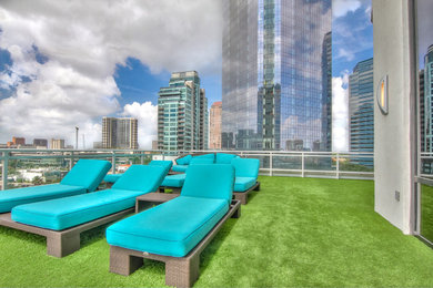 This is an example of a large contemporary full sun rooftop landscaping in Houston with decking.