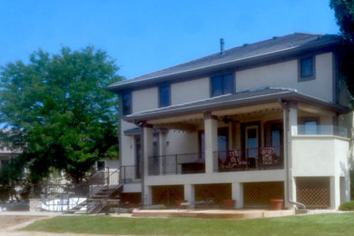 Large craftsman beige two-story mixed siding house exterior idea in Denver with a shingle roof