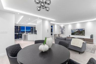 Example of a large trendy vinyl floor and beige floor dining room design in Vancouver with white walls