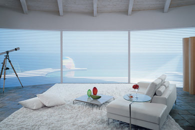 Inspiration for a mid-sized coastal formal slate floor living room remodel in Miami with white walls, no fireplace and no tv