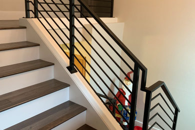 Staircase - large modern wooden l-shaped metal railing staircase idea in Portland with wooden risers