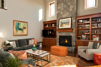 Photo of a large transitional formal enclosed living room in Boston with grey walls, dark hardwood floors, a standard fireplace, a stone fireplace surround, no tv and brown floor.