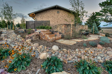 Large transitional backyard xeriscape in Denver.
