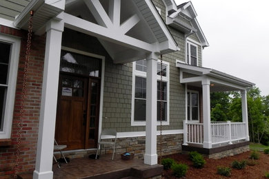 Large arts and crafts gable roof photo in Grand Rapids