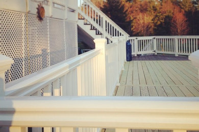 Example of a large classic backyard deck design in Manchester