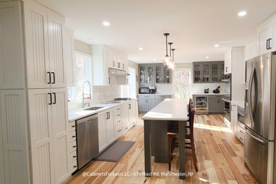 Mid-sized transitional home design photo in Manchester