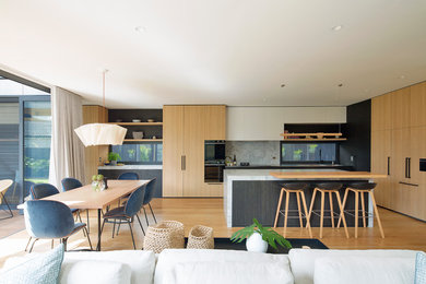 Inspiration for a mid-sized contemporary open plan kitchen in Sydney with with island.