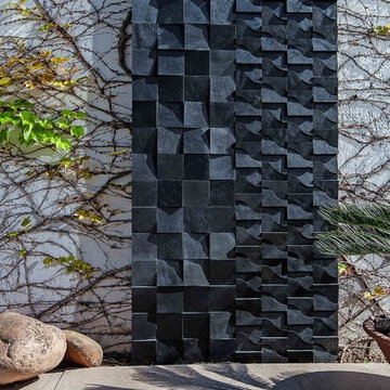 Modern backyard with mosaic wall
