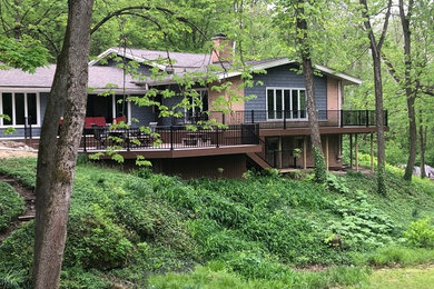 Inspiration for a large contemporary side yard deck remodel in Other