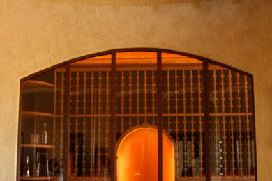 Large mountain style wine cellar photo in Phoenix