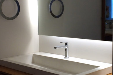 Example of a large transitional master beige tile limestone floor bathroom design in Charlotte with a trough sink, furniture-like cabinets, dark wood cabinets and beige walls