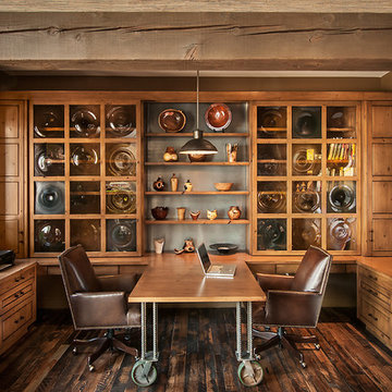 Office with glass doors closed, hiding work area