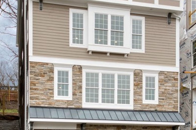 Transitional brown three-story mixed siding townhouse exterior photo in Cincinnati