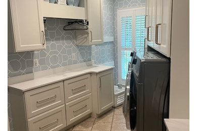 Example of a mid-sized transitional wallpaper laundry room design in Other with a single-bowl sink, flat-panel cabinets, white cabinets, quartz countertops and white countertops