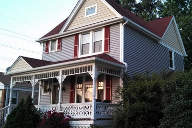 Large victorian gray two-story vinyl gable roof idea in Chicago