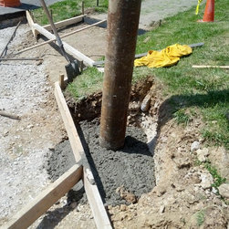 Concrete entrance with oversize steel deflector post at CVS - Products