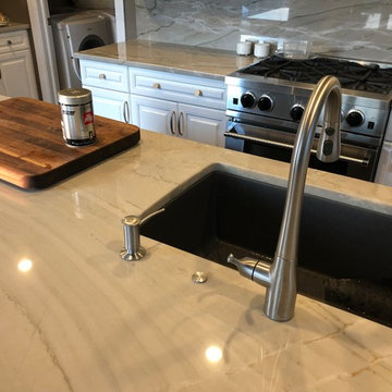 Remodeled Kitchen using Quartzite and new garbage disposal switch