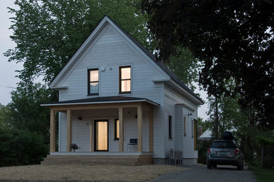 Small cottage white two-story wood gable roof photo in Boston