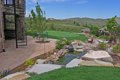 Design ideas for a large traditional backyard outdoor basketball/tennis/multi-game court in Denver.