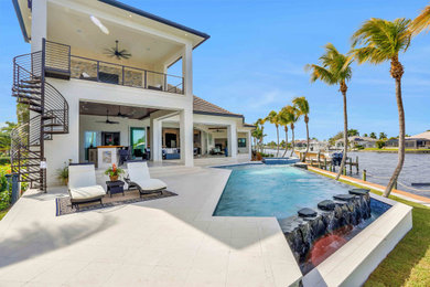 Example of a beach style home design design in Tampa