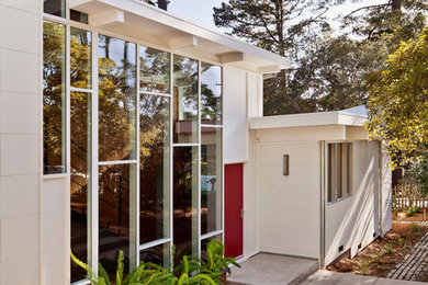 Design ideas for a midcentury white exterior in San Francisco with a flat roof.