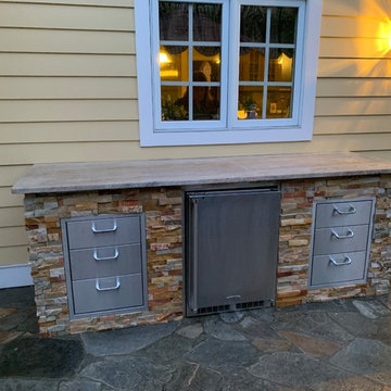 Traditional Outdoor Kitchen completing an Amazing Backyard
