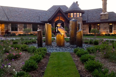 Photo of a rustic front yard water fountain landscape in Other.