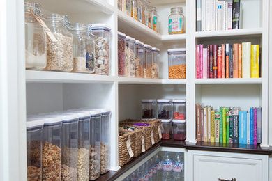 Elegant kitchen pantry photo in Phoenix