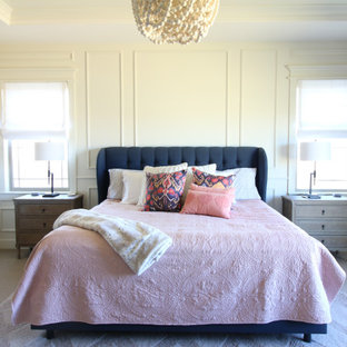 Großes Klassisches Hauptschlafzimmer mit weißer Wandfarbe, Teppichboden, Eckkamin, gefliester Kaminumrandung, beigem Boden, Holzdielendecke und vertäfelten Wänden in Denver