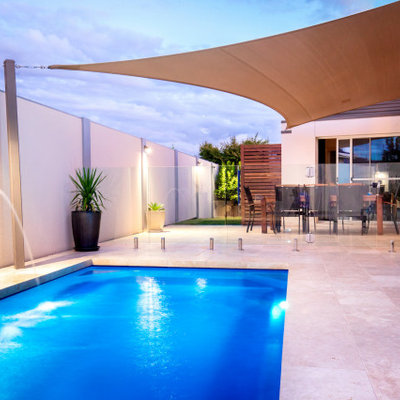 Inspiration for a modern tile and rectangular pool remodel in Dallas