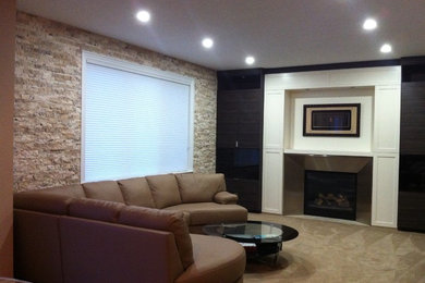 Mid-sized elegant open concept carpeted family room photo in Other with brown walls, a standard fireplace, a metal fireplace and a media wall