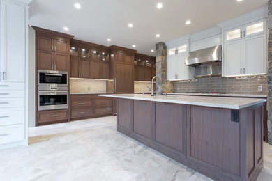 Example of a transitional kitchen design in Calgary